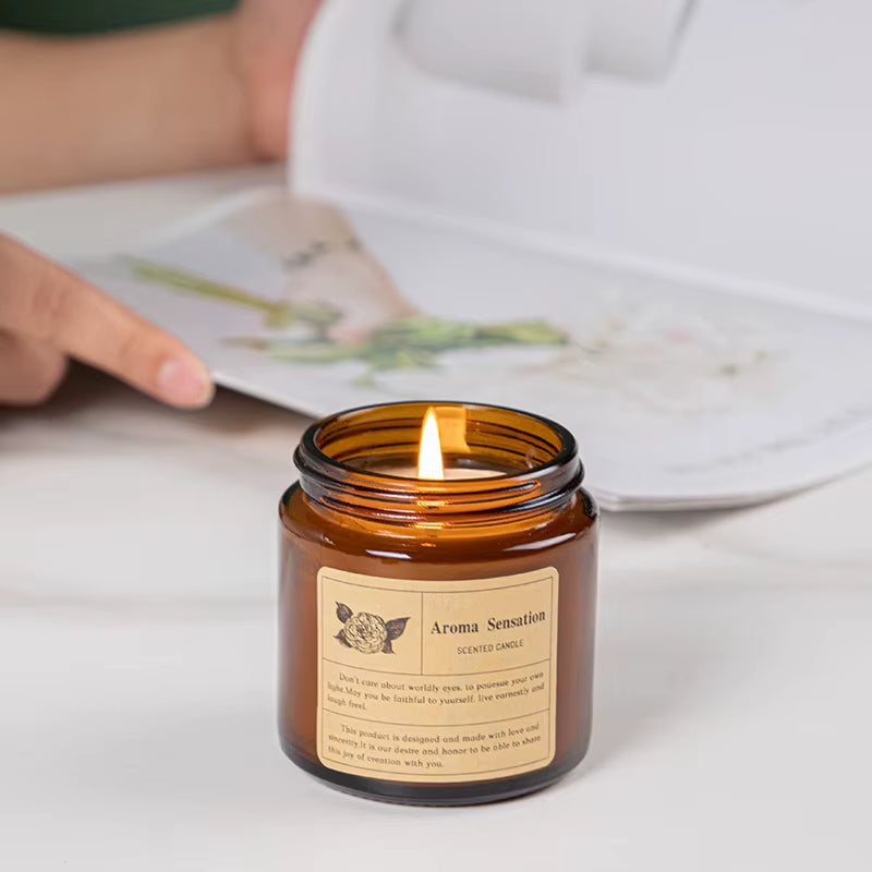 Aroma Sensation Hand-Poured Warm Vanilla Sandalwood Fragrance Cozy Ambiance Scented Candle Amber Glass Jar Relaxation Lit Flame